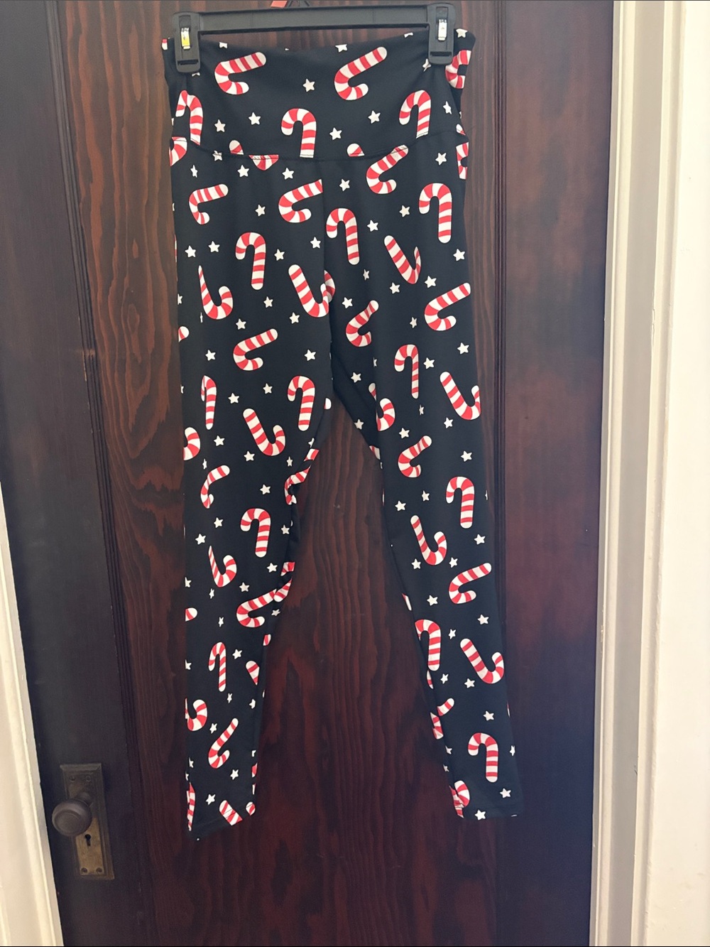 Tipsy Elves Black Leggings with Red and White Candy Cane Print